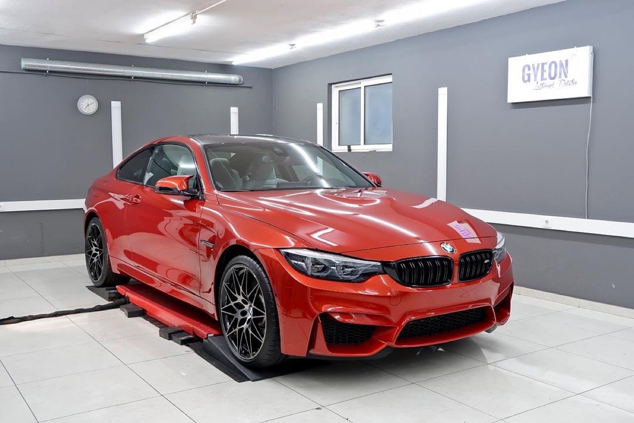 Red BMW M4, Gyeon ceramic coating, in our studio.