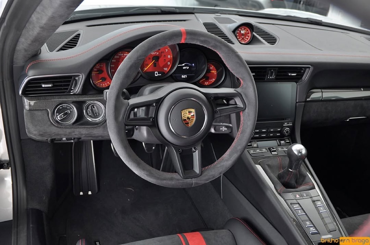 Detailed Porsche 911 GT3 interior — flawless steering wheel and console.